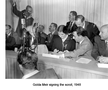 Golda Meir signing the scroll, 1948
